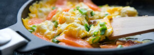 Scrambled eggs in butter with smoked salmon and chives