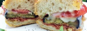 Sandwich with grilled eggplant, tomato and gorgonzola
