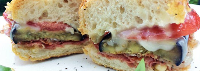 Sandwich with grilled eggplant, tomato and gorgonzola