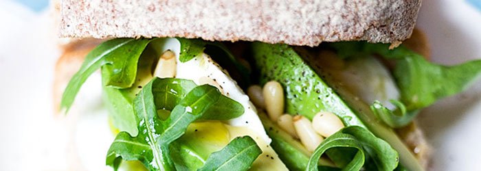 Mozzarella, avocado and arugula sandwich