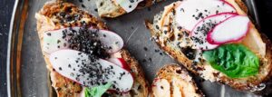 Sandwich with radish, chili butter and black sesame sprinkle