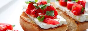 White cheese, tomato and basil sandwich