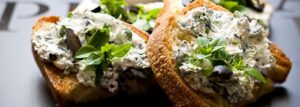 Goat cheese, olives and basil sandwich