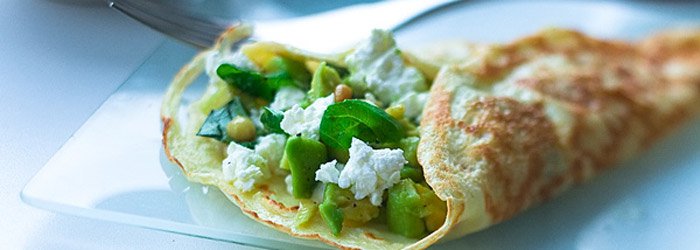 Pancakes with avocado and white cheese