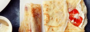 Crepes with custard cream and strawberry jam
