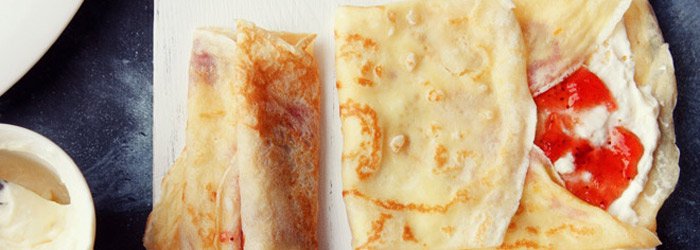 Crepes with custard cream and strawberry jam