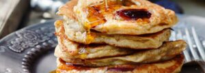 Whole grain pancakes with plums