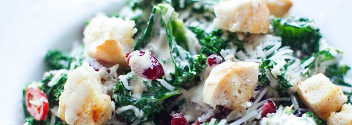 Caesar salad with kale, cranberry, and sunflower seeds