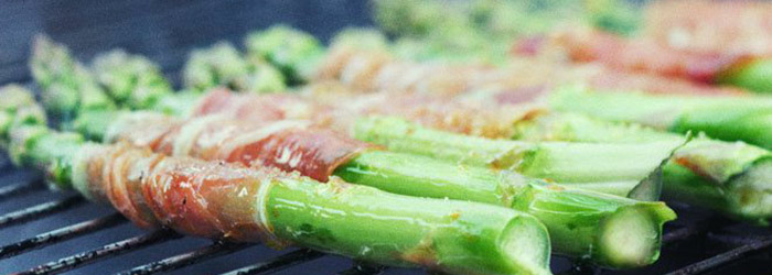 Spring salad with grilled asparagus, radish, and beet greens