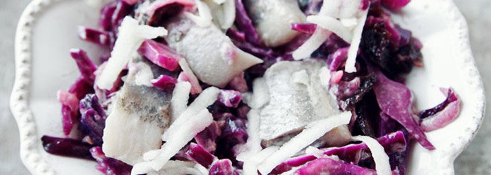 Herring salad with red cabbage and dried plums