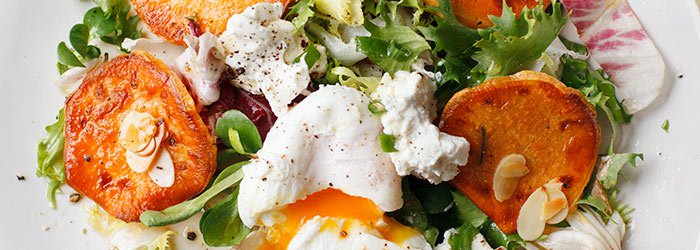 Salad with roasted sweet potatoes, ricotta and poached egg