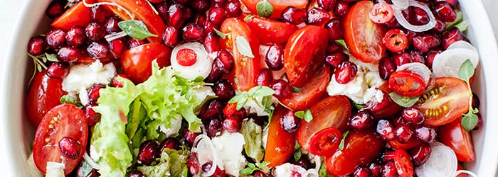 Salad with cherry tomatoes, pomegranate and feta