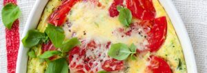 Baked omelet with zucchini, tomatoes and cheese