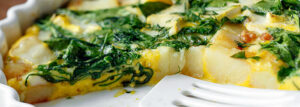 Baked omelet with potatoes, spinach and feta cheese