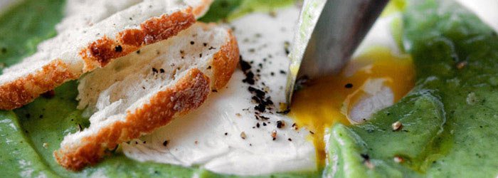 Broccoli soup with soft-boiled egg and truffle oil