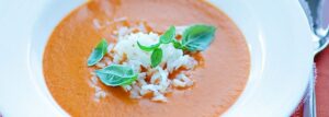 Cream tomato soup with ginger, basil and coconut milk