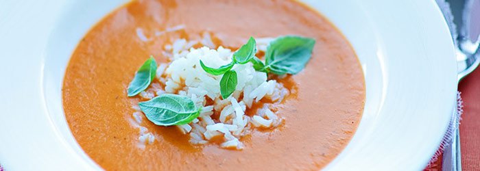 Cream tomato soup with ginger, basil and coconut milk