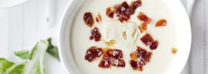 Creamy cauliflower soup with Parma ham shavings