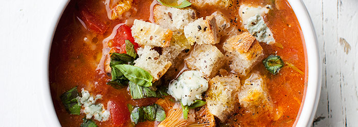 Soup with fresh tomatoes and chanterelles
